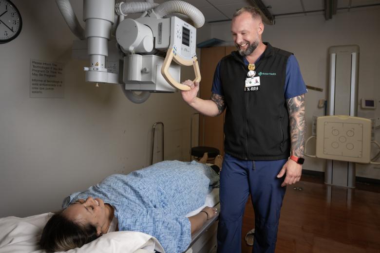 Pictured: Michael providing patient care while advancing his skills through Gurnick Academy’s upskilling program in collaboration with Sutter Health