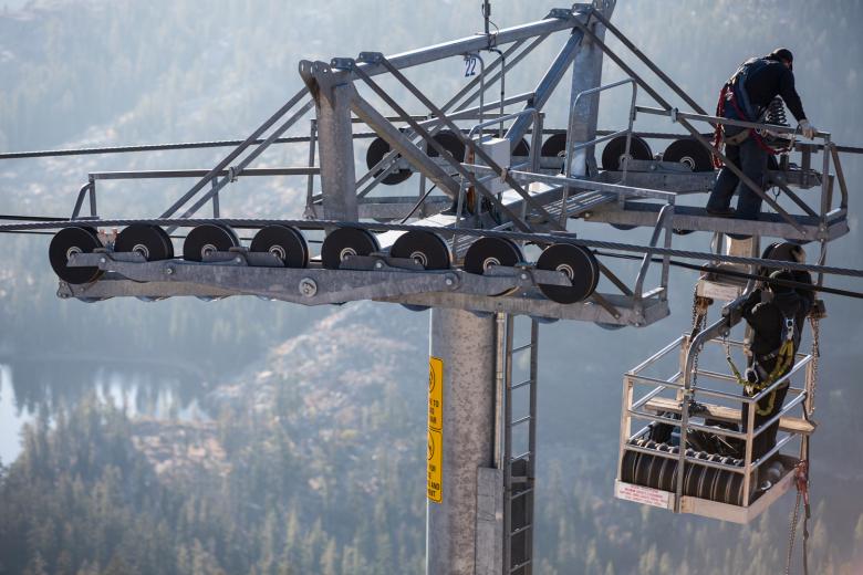 Teams of chairlift maintenance mechanics inspect tens of thousands of feet of steel cable and moving components to be sure the aerial ropeways are in working order before opening day. Teams of chairlift maintenance mechanics inspect tens of thousands of feet of steel cable and moving components to be sure the aerial ropeways are in working order before opening day.