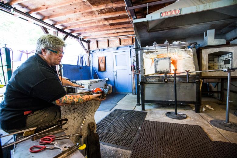 It was the catalyst for an expansion to a midtown location and a catalyst for business growth. “Not bad for a girl,” her male counterparts would tell her. In 3,000 years of glass-blowing history, not a single woman was mentioned until the American Studio Glass Movement began in the 1960s.  It was the catalyst for an expansion to a midtown location and a catalyst for business growth. “Not bad for a girl,” her male counterparts would tell her. In 3,000 years of glass-blowing history, not a single woman was mentioned until the American Studio Glass Movement began in the 1960s.