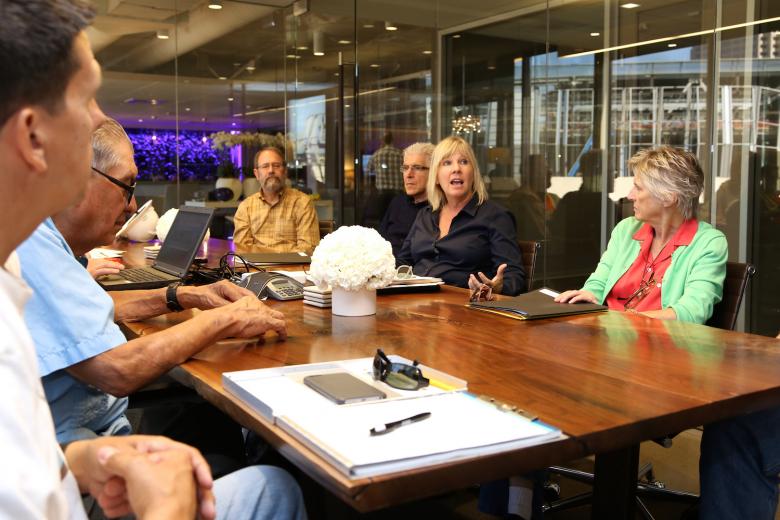 With the arena’s reflection behind her, SMAC Executive Director Shelly Willis leads one of four orientation sessions for artists invited to submit arena art proposals. Attending this session were (from left) Rene Villa, artist Esteban Villa, Mark Roos of BBI Engineering, artist Bill Fontana and artist Suzanne Adan.
With the arena’s reflection behind her, SMAC Executive Director Shelly Willis leads one of four orientation sessions for artists invited to submit arena art proposals. Attending this session were (from left) Rene Villa, artist Esteban Villa, Mark Roos of BBI Engineering, artist Bill Fontana and artist Suzanne Adan.