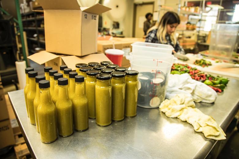The morning’s work yields about 200 bottles of pineapple jalapeno hot sauce, which is sold at Sac High and online.