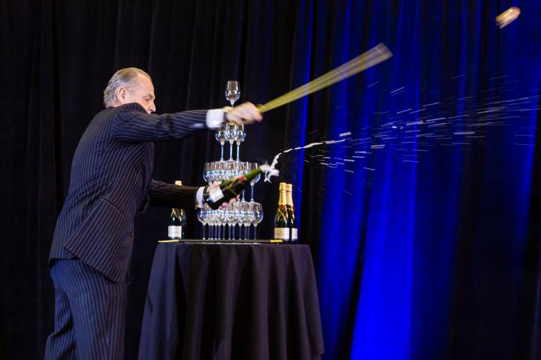 Jereon Garrese, Assets Manager, kicks off the event by sabering champagne. Jereon Garrese, Assets Manager, kicks off the event by sabering champagne.