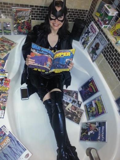 Bat Girl definitely got her geek on, reading comics in a hopefully bullet proof tub. Bat Girl definitely got her geek on, reading comics in a hopefully bullet proof tub.