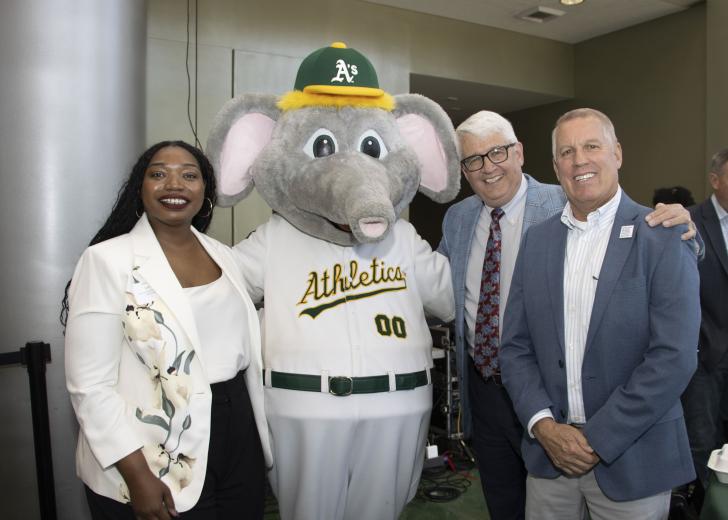 Jeneba Lahai, executive director & board president, Yolo County Children’s Alliance; A’s Mascot “Stomper”; Dana Davis: President, Teichert Materials and Michel Smith, manager, Teichert, Inc