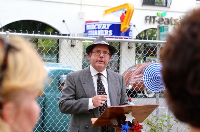 On Friday, June 26, CADA Deputy Executive Director Mac de la Vergne stood at the former site of the cleaners and led a neighborhood countdown to the relighting of the sign. On Friday, June 26, CADA Deputy Executive Director Mac de la Vergne stood at the former site of the cleaners and led a neighborhood countdown to the relighting of the sign.