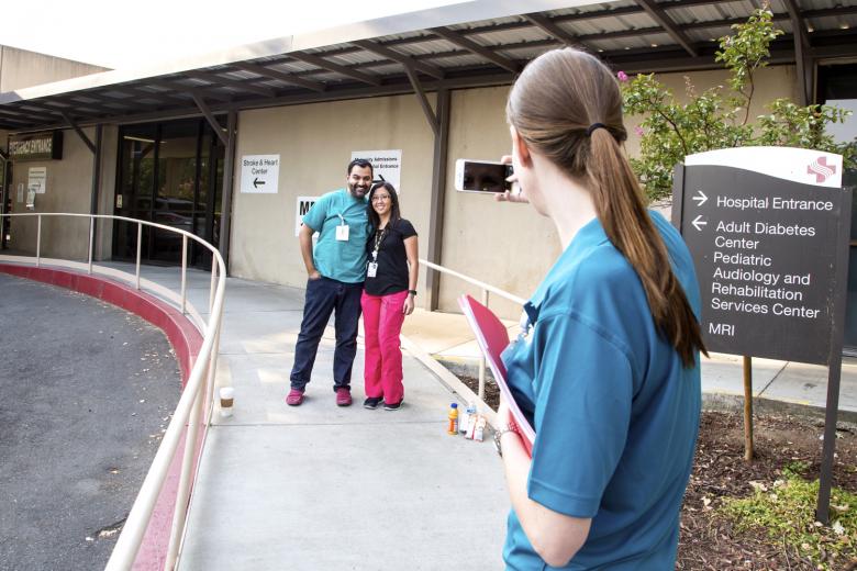 Stephanie Breitbart (right) takes a photo of fellow employees Jasnel Singh and Muey Saephan at Sutter Memorial Hospital, which remained fully staffed on Saturday, August 8, 2015, as patients were transferred to the new Sutter Medical Center in midtown Sacramento. Stephanie Breitbart (right) takes a photo of fellow employees Jasnel Singh and Muey Saephan at Sutter Memorial Hospital, which remained fully staffed on Saturday, August 8, 2015, as patients were transferred to the new Sutter Medical Center in midtown Sacramento.
