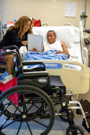 But with his hectic schedule of radiation, dialysis and therapy, it’s not always easy to find time for school. “He’s a gem of a kid, and I really enjoy him,” Castles says of Maurice, “but it’s a lot of energy for him to exert. He’s getting stronger and doing a lot better, but it can take a lot out of him.”
But with his hectic schedule of radiation, dialysis and therapy, it’s not always easy to find time for school. “He’s a gem of a kid, and I really enjoy him,” Castles says of Maurice, “but it’s a lot of energy for him to exert. He’s getting stronger and doing a lot better, but it can take a lot out of him.”