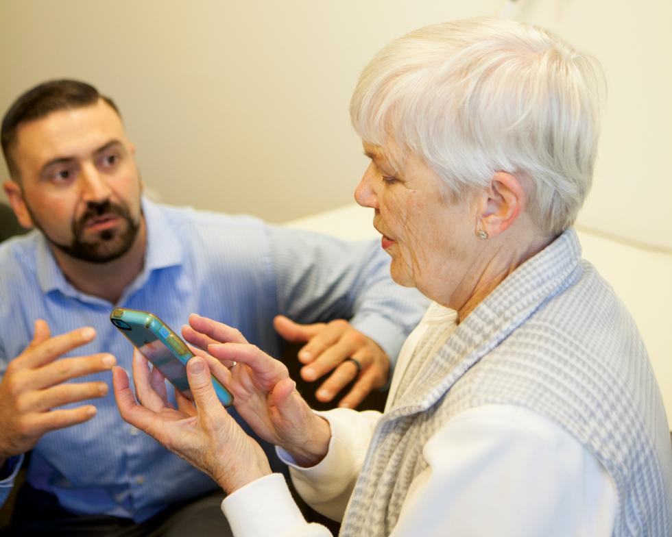 Paul Gray (left), is an access technology instructor at Society for the Blind in Sacramento. He came to the society after losing his vision to a degenerative disease at age 16.