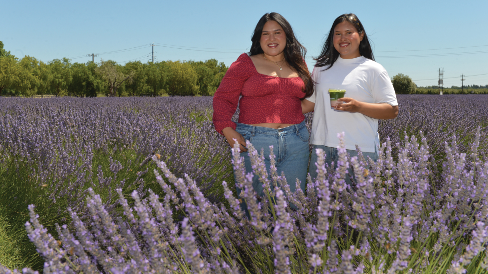 Roxana and Vilma Elvir, the twin sisters behind The Point Matcha and Coffee, display their strawberry matcha at a pop-up event at HvH Specialty Growers June 13. (Photo by Bea Ahbeck)