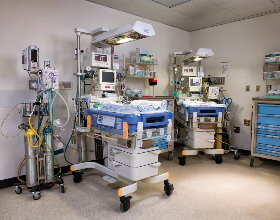After birth at UC Davis Medical Center, babies are placed on these neonatal tables, where a team of doctors and nurses can focus on the newborn while the mother is still in the adjacent operating room.

