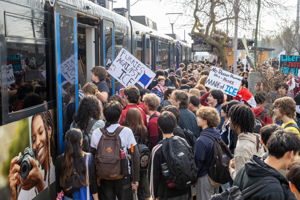 After marching from McClatchy High School, protesters board the train at the 4th Avenue/Wayne Hultgren Light Rail station before heading to the State Capitol during the Jan. 30 ICE OUT! national protest.