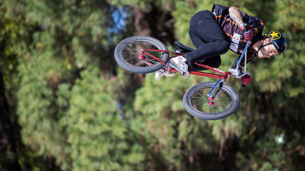 With a backdrop of trees, XC New York’s Daniel Sandoval rides during the Men’s BMX Park finals on Friday, June 26.
