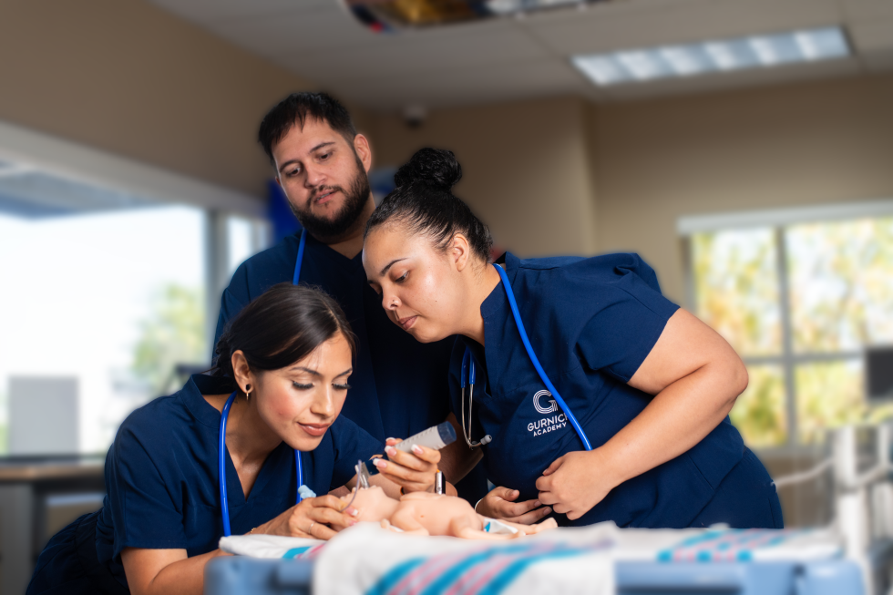 Pictured: Respiratory Care students performing an endotracheal intubation on a premature neonatal mannequin