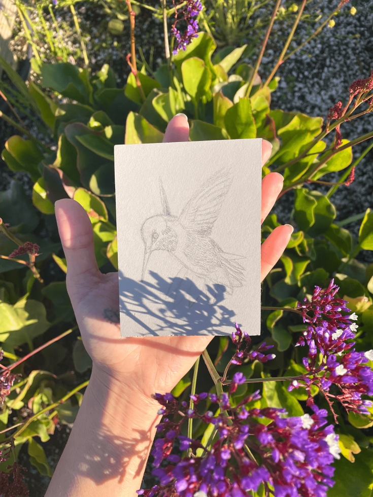 Muñoz demonstrates how she captures shadows from plants in her garden by tracing them onto her block before carving. (Photo courtesy of Jazel Muñoz)