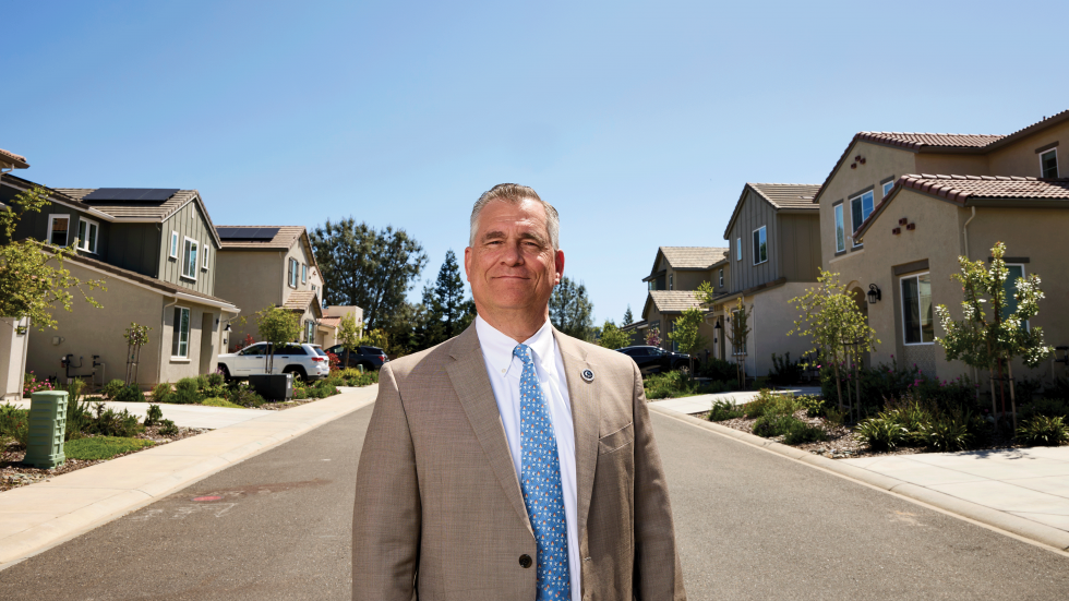 Newly built homes and communities in California now have wider streets to allow fire trucks to get in and for residents to evacuate, says Chris Ochoa, senior counsel for codes, regulatory and legislative affairs at the Sacramento-based California Building Industry Association. He’s standing in the Tri Pointe Homes development in El Dorado Hills.
(Photo by Fred Greaves)