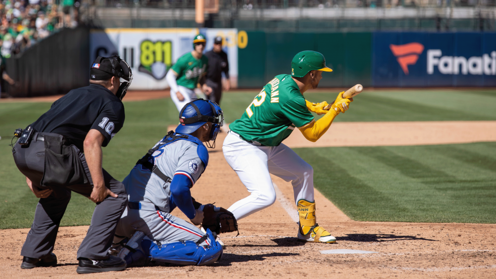 A’s shortstop Max Schuemann attempts a bunt in the bottom of the eighth inning on Sept. 26 during the team’s final inning at the plate in Oakland.