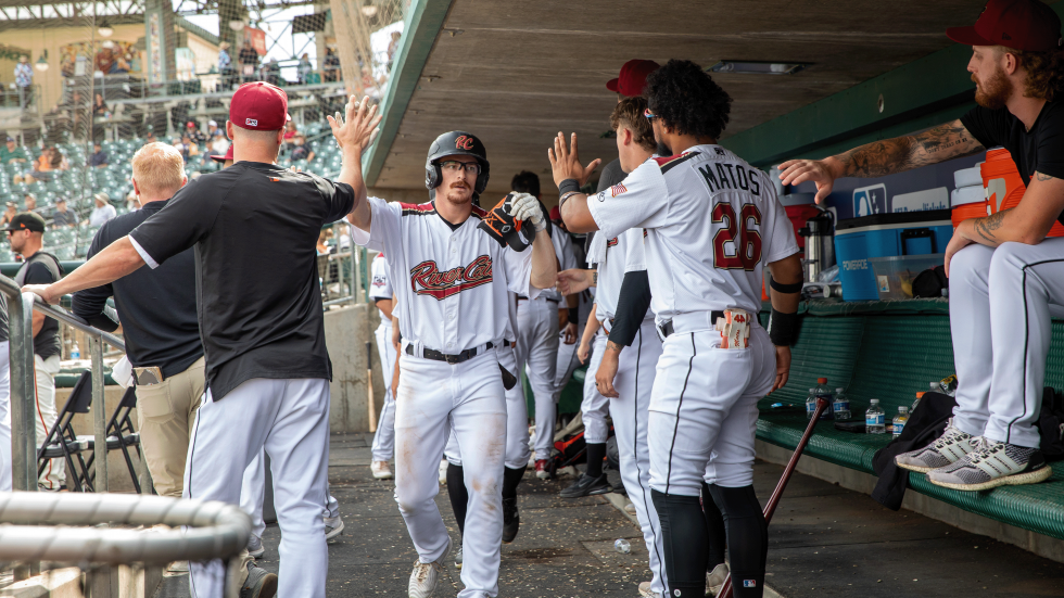 River Cats leadoff hitter Wade Meckler is congratulated after his two-run home run in the bottom of the ninth inning on Sept. 18 pulled the River Cats to within a run of the Sugarland Space Cowboys. River Cats would lose 5-4.