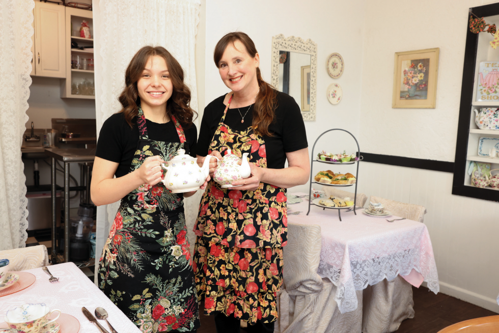 Dena Macklin (right), owner of The Tea Nook, operates her Lincoln team room with just one employee, “Tea Hostess” Alina.