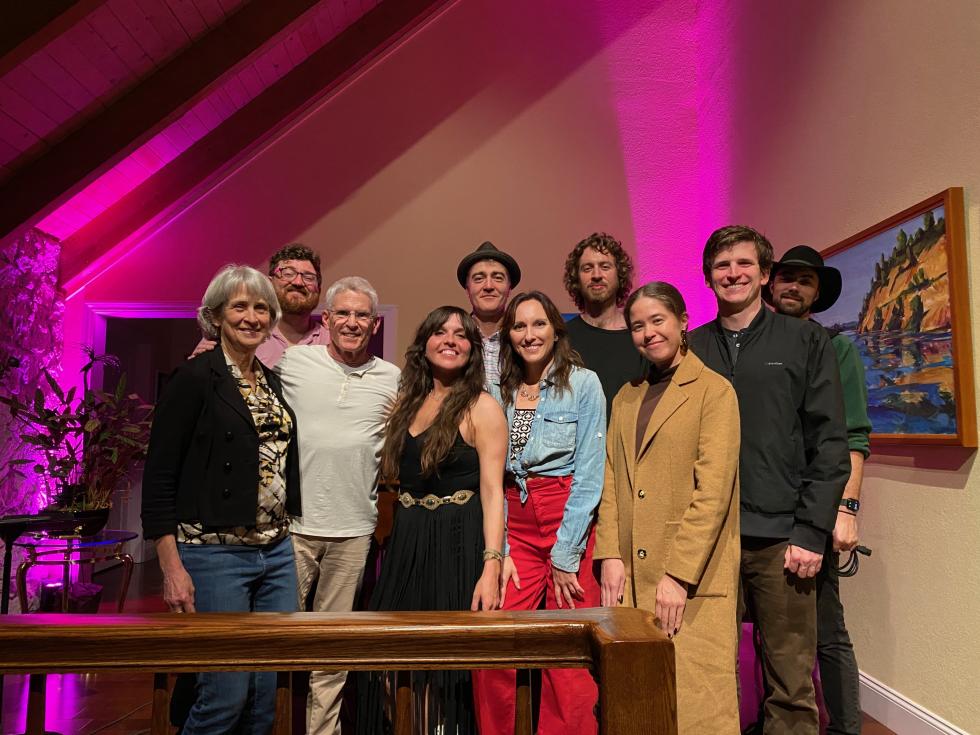 Emily and Mark Kassenbrock, left, stand next to songstress Jessica Malone, center, and her band after a performance in mid-February. (Photo by Phil Kampel)