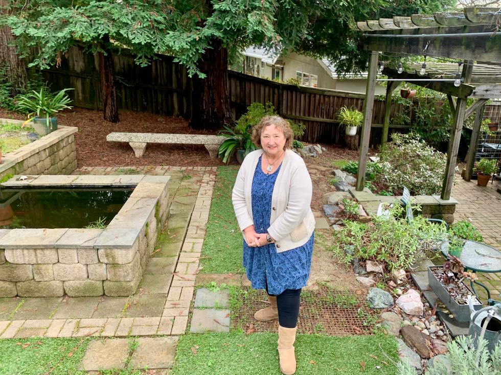 Jenny Stanionis went to house concerts for decades before deciding to host one herself last summer in backyard in Auburn. (Photo by Scott Thomas Anderson)