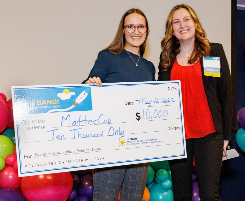 UC Davis communication and art history double major Chantal Deslauriers (on the left), co-founder of MatterCup, received the $10,000 Energy + Sustainability Award from Heidi Pyle (on the right) of SMUD. SMUD sponsored the $10,000 Energy + Sustainability Award.