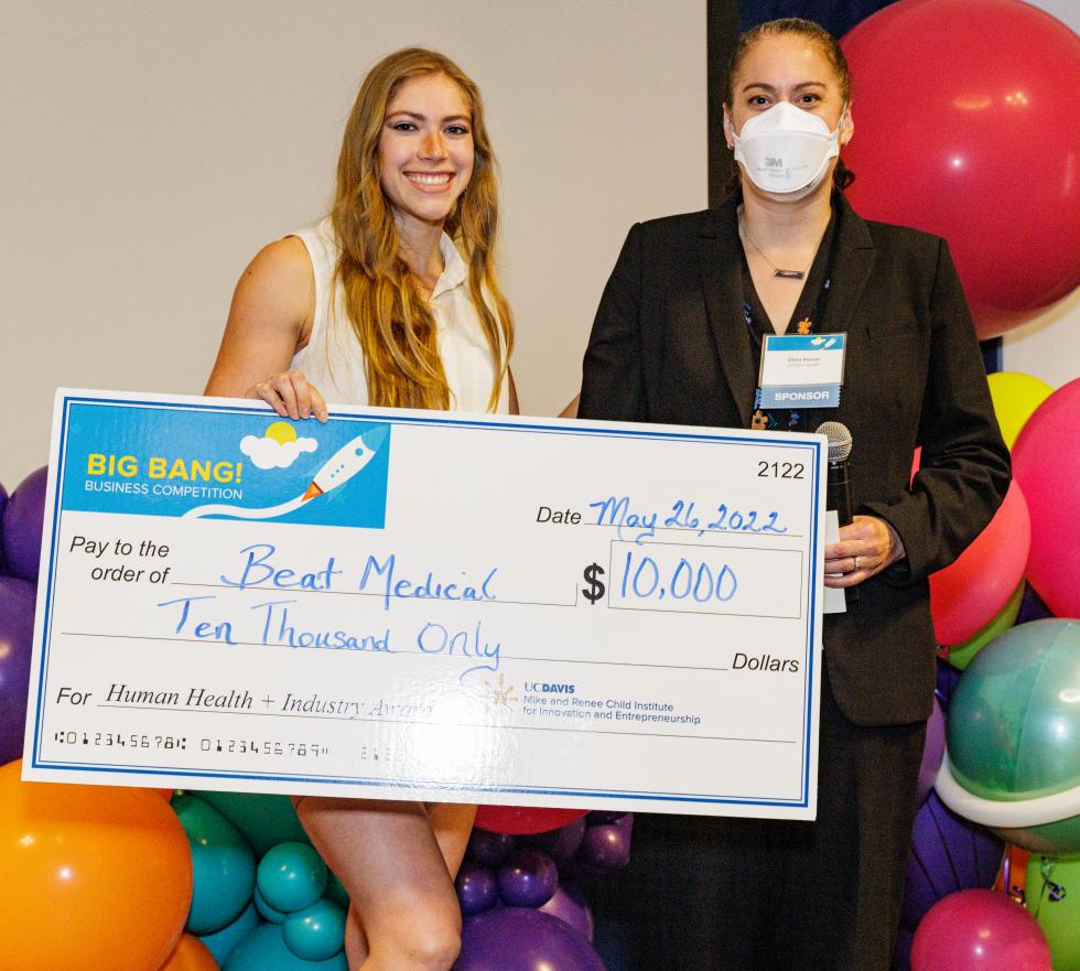 UC Davis biological science major Kalie Marland (on the left), co-founder of Beat Medical, received the $10,000 Human Health and Industry Sector Award from Elissa Roser (on the right), assistant dean and chief of staff at the UC Davis School of Medicine. Beat Medical has developed an innovative breathing tube holder.
