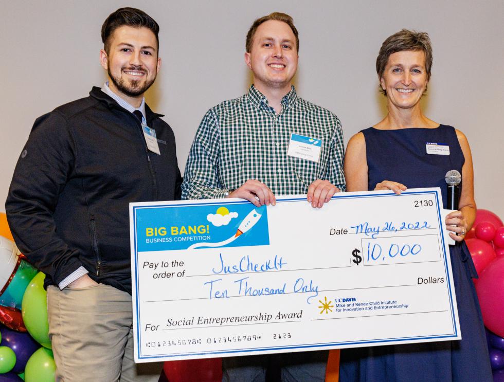 Cameron Gallad (on the left), CEO of JusCheckIt, and Jackson Wise (in the center), CFO of JusCheckIt, received the $10,000 Social Entrepreneurship Award, presented by Karen Harding-Davis, program coordinator at the Mike and Renee Child Institute for Innovation and Entrepreneurship. UC Davis alumni Cameron Gallad and Jackson Wise are co-founders of the startup, which is creating an online community for legal information and representation.