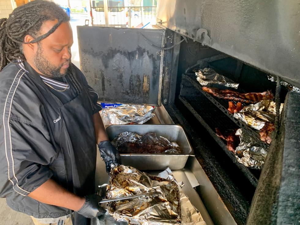 Kenneth Rowe II, the pit master behind Low & Slow BBQ, says he's looking forward to being part of combined Lunar New Year and Mardi Gras events this year. (Photo by Scott Thomas Anderson)