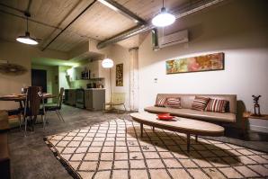  Units in the renovated industrial space at Warehouse Artist Lofts feature exposed ductwork, original concrete columns and period-appropriate light fixtures.
