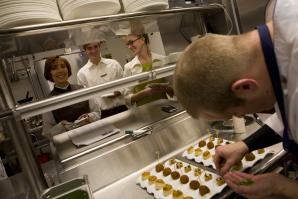 Kitchen staff plates hors d'oeuvres on the Ritz-Carlton's opening day