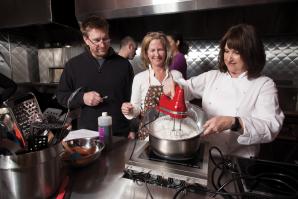 Paulette Bruce (far right), owner of Good Eats Cooking Classes, teaches a Sunday morning group at East Bay Restaurant Supply.