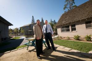 Randy Tooker, chief professional officer of the Auburn Boys & Girls Club, with Community 1st Bank president Mark Lund at the club's new site