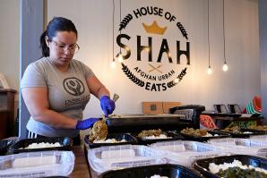 Juliana Garcia Shahsamand, co-owner of House of Shah in Woodland, prepares meals for Yolo Delivers Hope, a program that provides meals for homebound seniors, low-income families and migrant farm workers. (Photos by Fred Greaves. Click to view slideshow.)