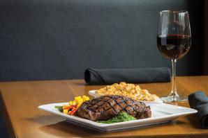 At The Independent, dry-rubbed, ancho-crusted ribeye with housemade chimichurri, vegetables and truffle mac and cheese. Paired with a 2010 Sierra Foothills Windwalker Vineyard Zinfandel