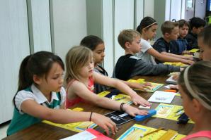 Students feel examples of braille during an ATOU workshop. (Photo courtesy Meghan Adamski)