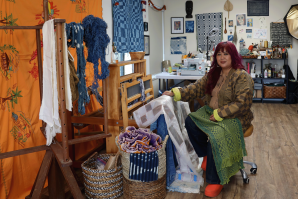 Jamie Pesquiza Cardenas sits at her loom in the shared studio she was able to access with her Creative Growth Award. (Photos by Melissa LuVisi)