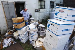 Certified Public Accountant John Sterling looks at damaged boxes of records removed from his Crisfield, Md. office after superstorm Sandy

(Photo by AP Photo / Alex Brandon)