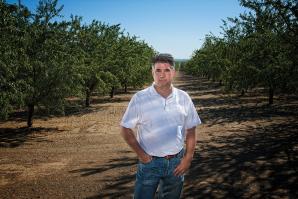 Keith Fichtner, project manager for Dunnigan Land Development Trust, plans to build 8,000 homes on the site of this almond orchard and nearby agricultural land. 