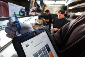Drewski’s Hot Rod Kitchen uses Square, a mobile credit card reader, to process customer payments on location.