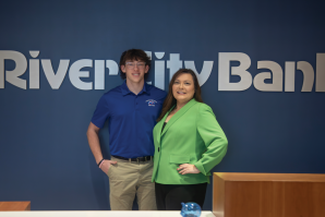 Pat Lewis, chief operating officer for River City Bank, teaches financial literacy classes. Her son, Joshua, says he learned a lot from the financial literacy course he took at Christian Brothers High School. (Photos by Terence Duffy)