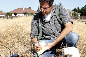 Derek Jacks, an environmental specialist for Sacramento County, spends a few hours of each workday searching for and documenting abandoned wells. 
