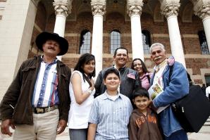 Mexican national Yulithza Ortiz (center) strands outside the Memorial Auditorium surrounded by family after his U.S. citizenship ceremony last month. 