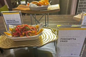 The smashburger served at Paragary's is one of the most popular food items at the Golden 1 Center. This year, Kings executive chef Chef Brien Kuznicki and his team elevated it by adding barbecue sauce. Alongside the burger is the new porchetta fries, made with rotisserie pork atop crinkle cut fries. (Photos by Judy Farah)