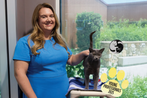 Christine Wolfe, here shown with a cat at Bradshaw Animal Shelter, is director of government affairs at WM. (Photo by Fred Greaves, expanded with Adobe)