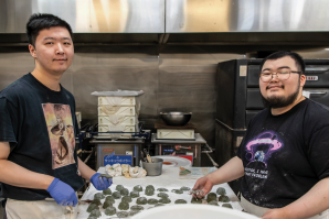 David and Yoshiro Murakami, sons of Osaka-Ya owner Linda Nakatani, make mochi at the business that has been in their family since 1963. (Photos by Debbie Cunningham)