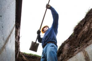 East Lawn Memorial Park has roots that go back more than 110 years — before “six feet under” was just a euphemism. Groundsman Nick Ustymchuk uncovers a concrete chamber, which will hold a casket or cremated remains