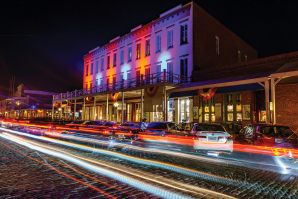 Cars travel across the brick road on Front Street in Old Sacramento Waterfront. A 2019 report found the business district is underperforming compared to similar historic districts in other cities. (Photos by Brad Branan)