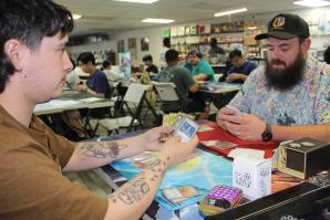 Eli Limon (left) plays against Mike Moreno (right) in a Pokémon trading card game tournament held May 31 at Skyscraper Comics in Sacramento. (Photo by Eric Schucht)