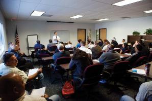 Unemployed San Joaquin residents gather at WorkNet to hear a seminar on building a resume. 