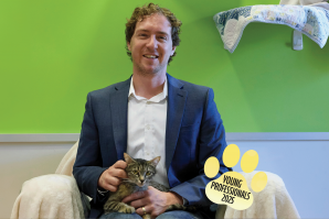 Jack Davis is an associate attorney at Kershaw Talley Barlow. Sherise is a resident of Bradshaw's Cat Cafe. (Photo by Fred Greaves, expanded with Adobe)
